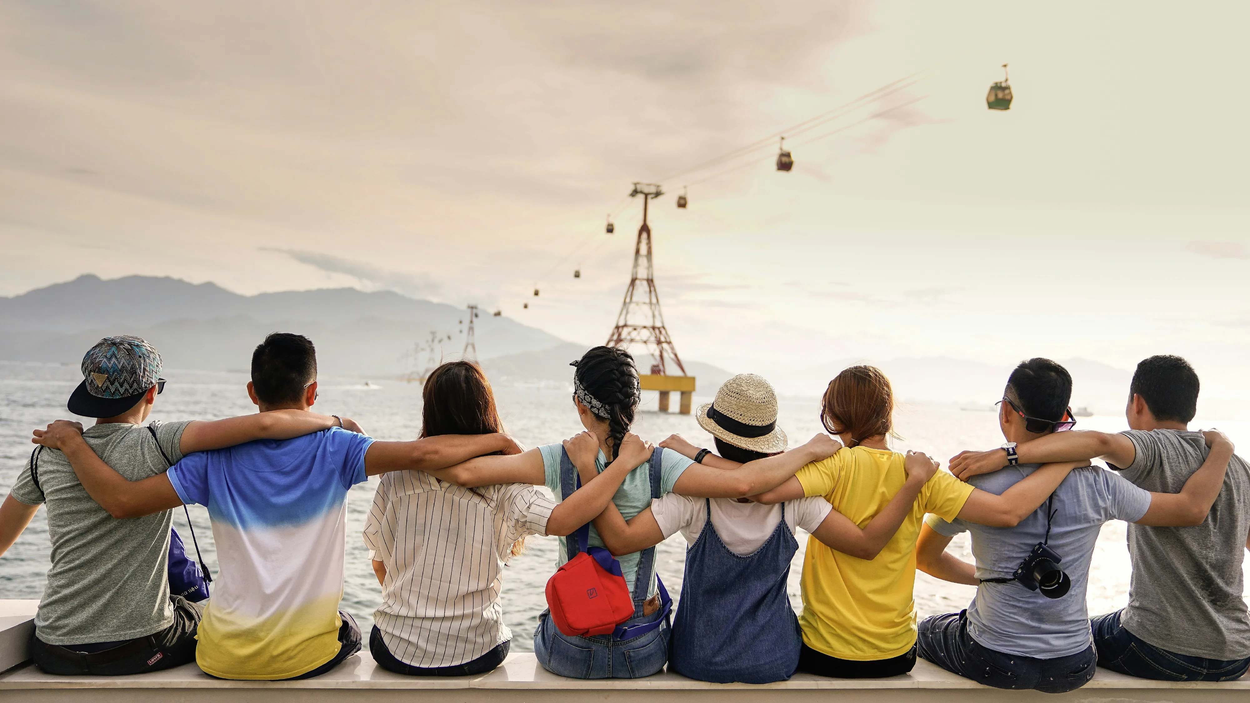 Group of players reacting with delight around the table.